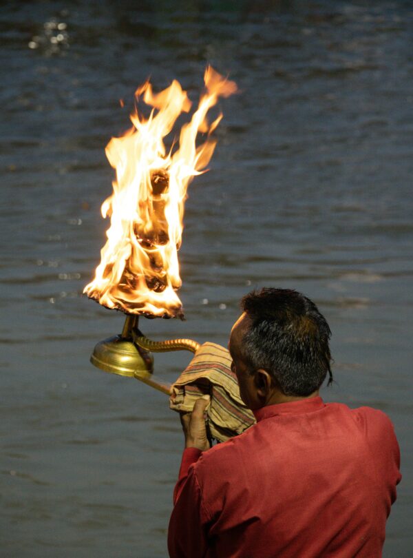 Experience the spiritual essence of the Ganga Aarti ritual by the river in Haridwar, India.